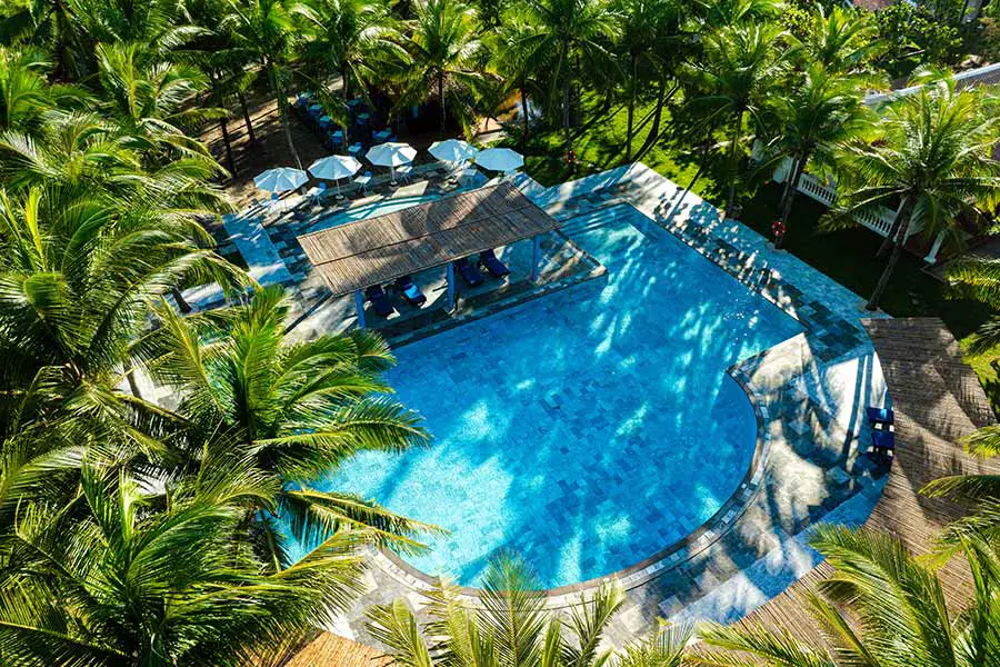 pool aerial view rmh le belhamy beach resort